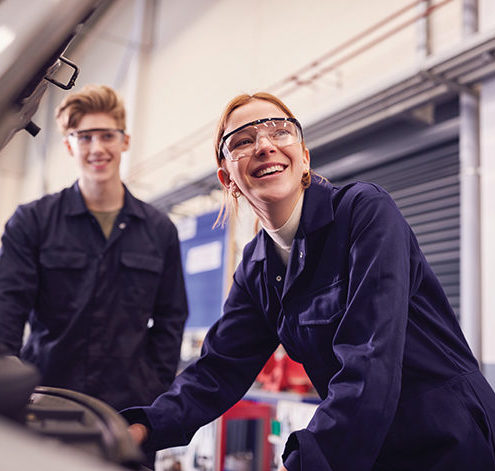 Male,And,Female,Students,Looking,At sheet metal