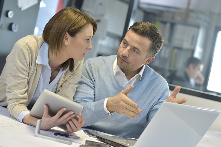 process design management business people in office working on laptop and tablet