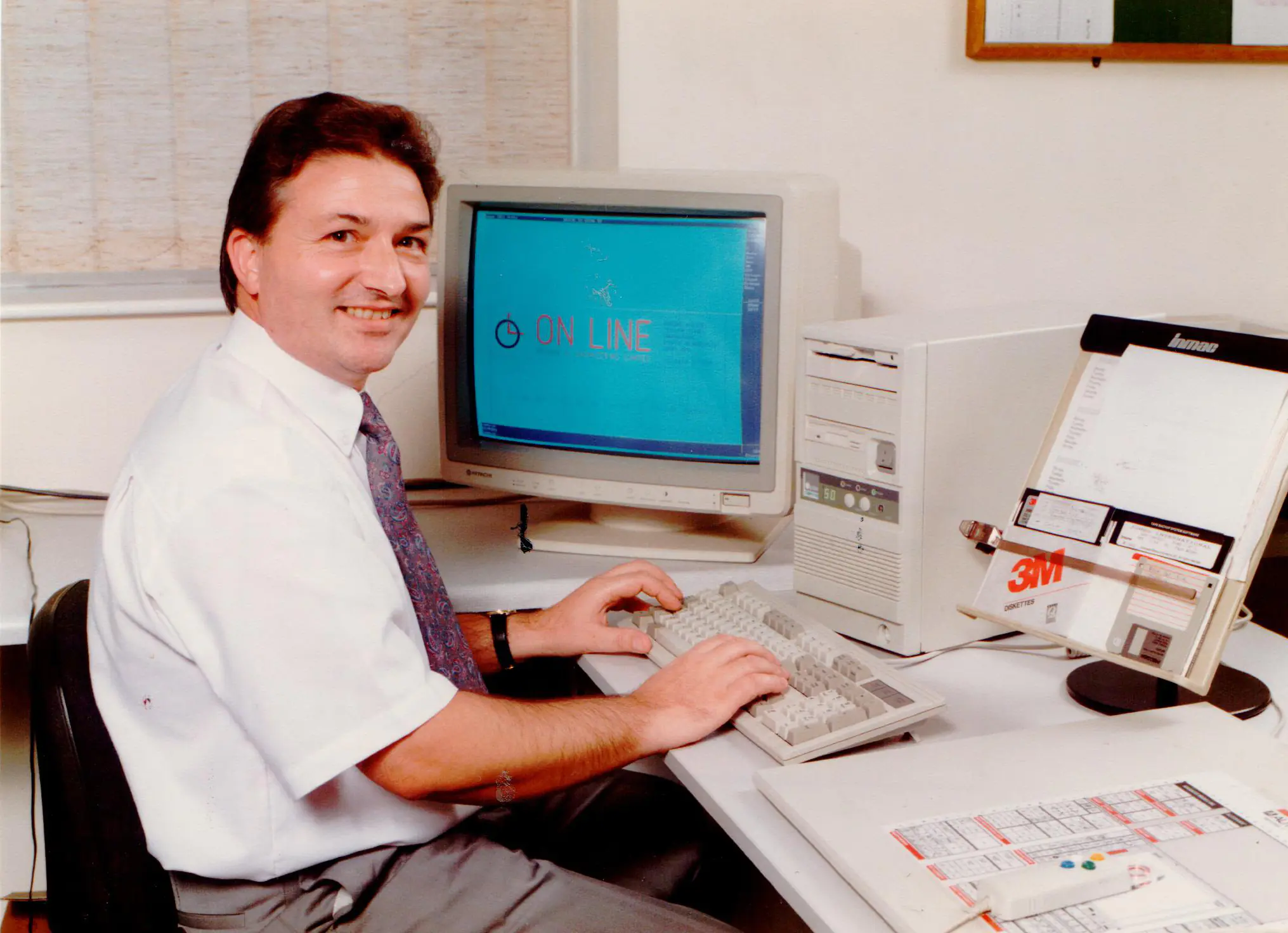 Roy working on a computer in 1990