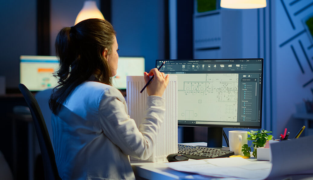 woman working on a computer to ensure perfect CAD services