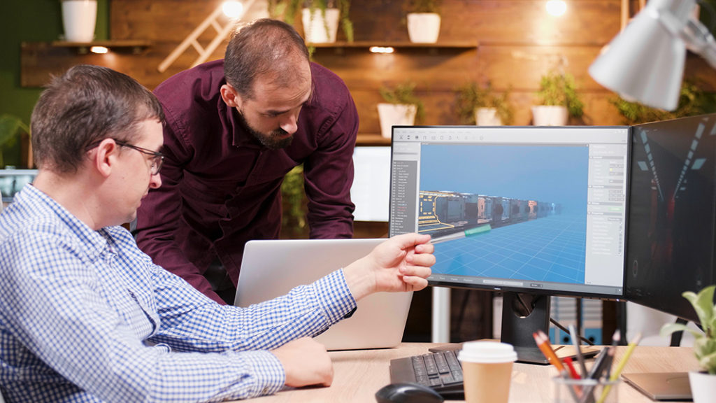Graphic designer demonstrating on screen