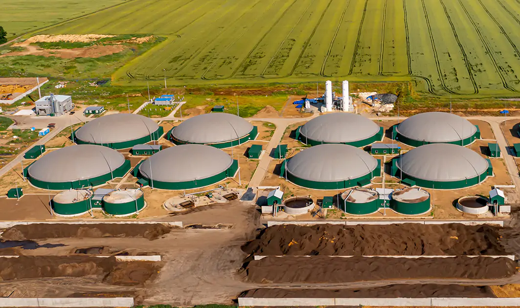Aerial view of green biogas plant storage tanks