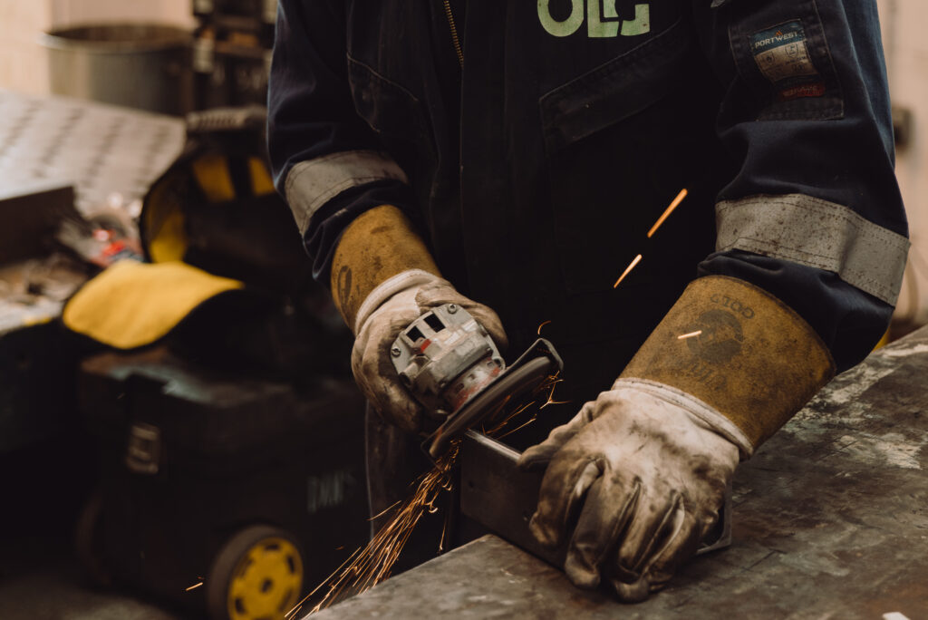 Close up of engineer working on sheet metal fabrication.