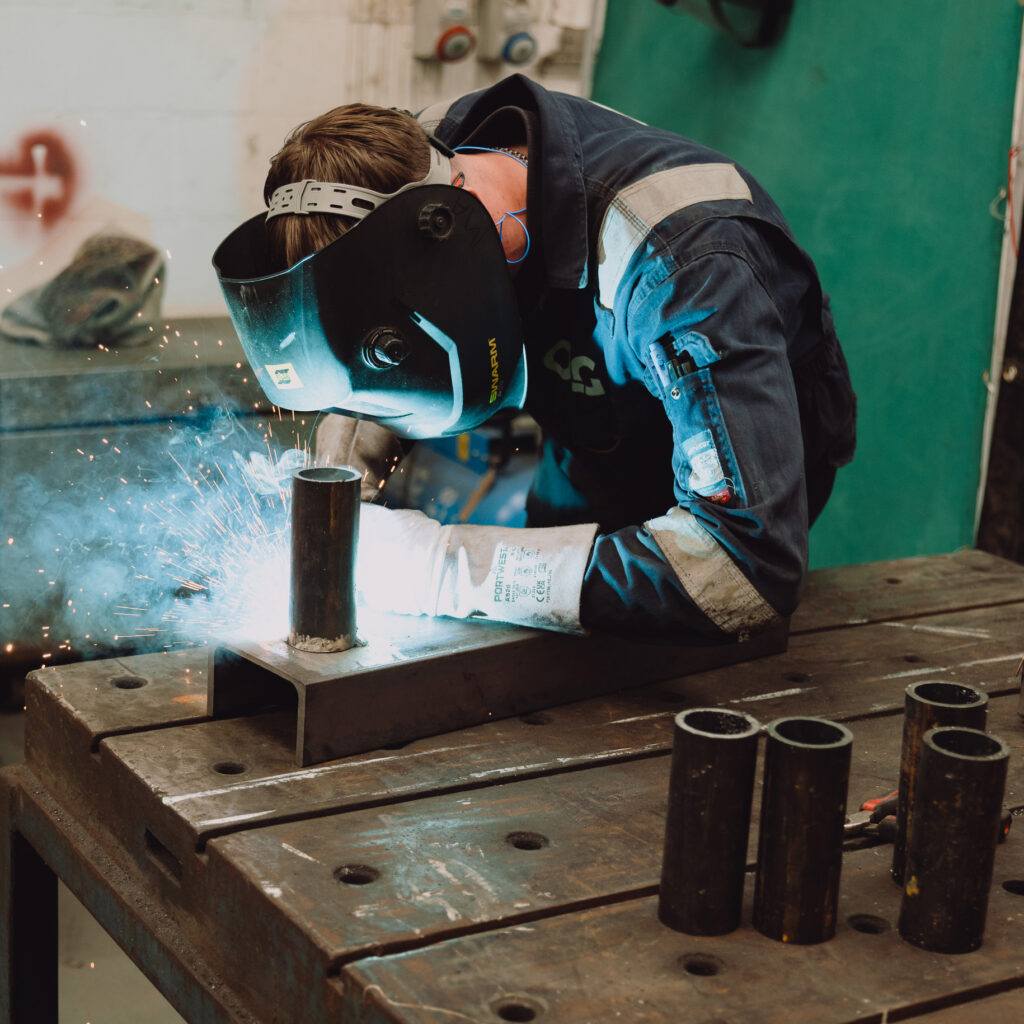 OLG engineer welding and wearing PPE.